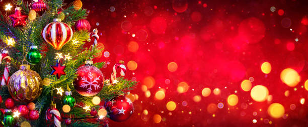 Christmas Tree In Red Background - Ornament And Abstract Defocused Lights Merry Christmas - Christmas Tree In Red Background - Baubles Hanging Fir Branches With Shiny Lights def picture photos stock pictures, royalty-free photos & images