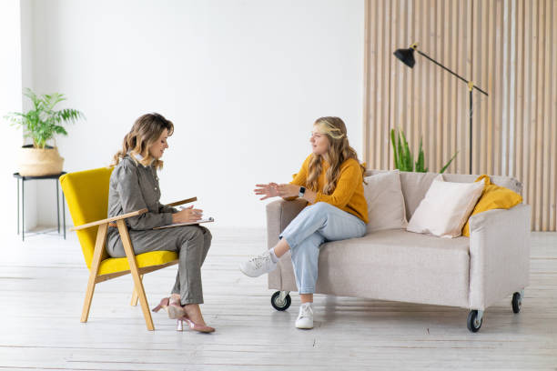 Woman psychologist works with teenage girl in her office. Psychological health. Woman psychologist works with teenage girl in her office. Psychological health. interrogation woman stock pictures, royalty-free photos & images