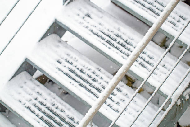Steel staircase covered with fresh snow