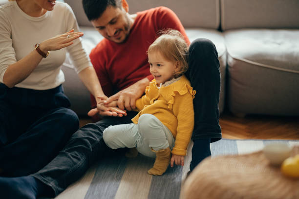 istock Family Bonding: Mom, Dad and Daughter Spending Quality Time At Home 1356633278