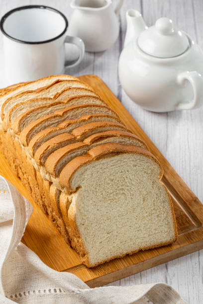 istock Sliced bread loaf on the table. 1356634184