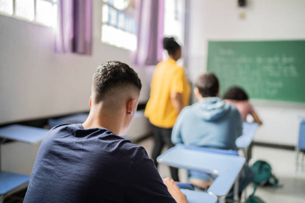istock Teenage student studying in the classroom 1356634721