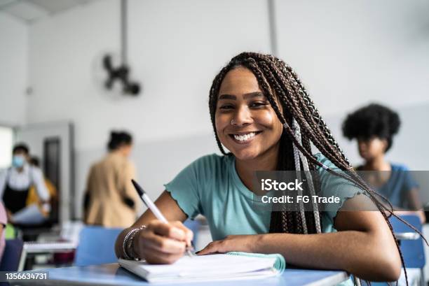 Portrait Of A Teenage Student In The Classroom Stock Photo - Download Image Now - Teenagers Only, Teenage Girls, Educational Exam