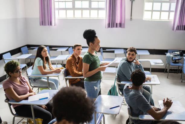istock Student reading aloud in the classroom 1356636083
