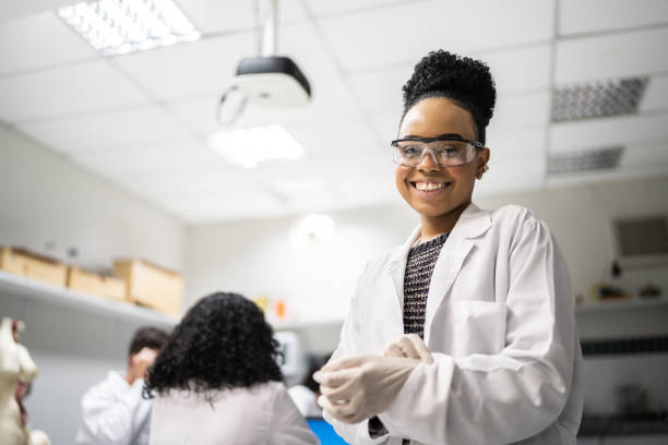 Portrait of a female student in the laboratory Portrait of a female student in the laboratory biology class stock pictures, royalty-free photos & images