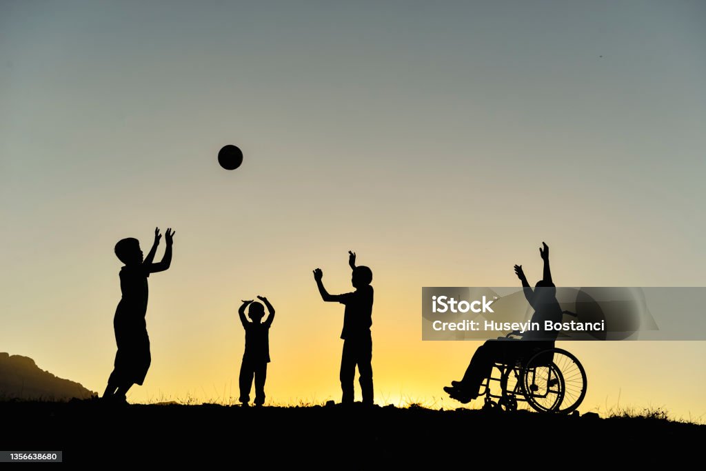 children with support for their friends with disabilities and a happy environment Disability Stock Photo