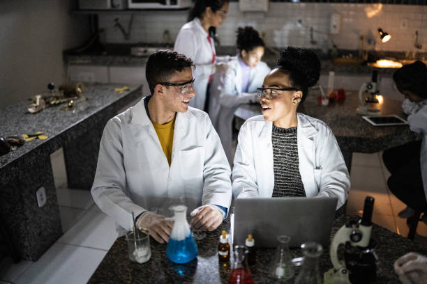 istock Students studying in a lab at school or university 1356640058