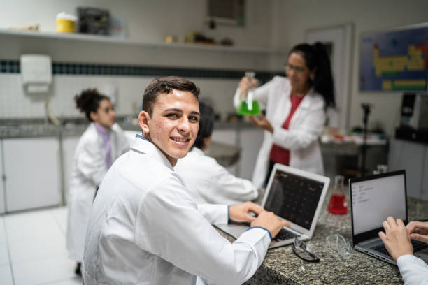 portrait of a male student during chemistry class - professor scientist chemistry teacher imagens e fotografias de stock