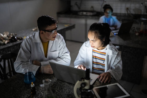 istock Students studying in a lab at school or university - including person with special needs 1356640240