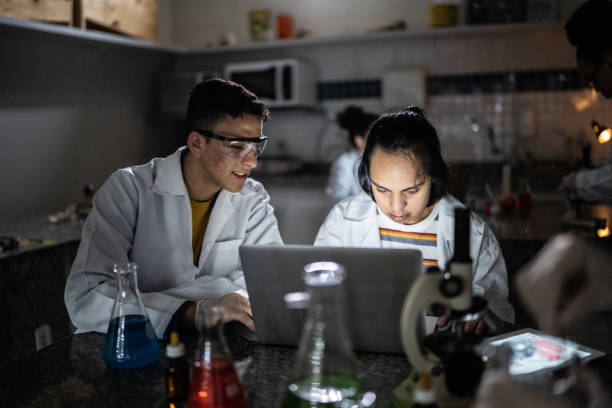 istock Students studying in a lab at school or university - including person with special needs 1356640285