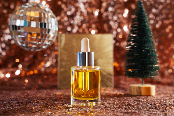 istock face oil on sequin background with disco ball and tree 1356642846