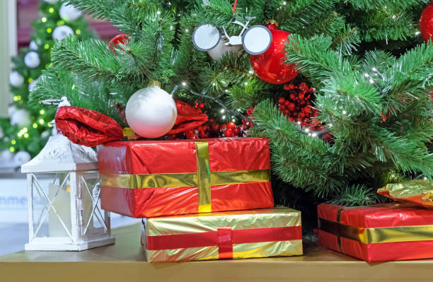istock Boxes with gifts under a decorated Christmas tree. 1356643149