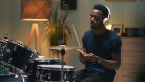 istock African American drummer rehearsing in evening 1356644028