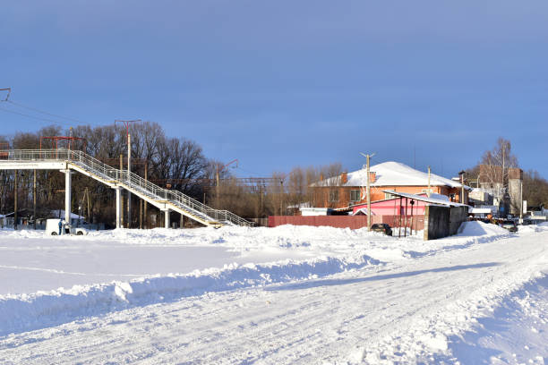 istock Village. Winter. Square, footbridge and large building. 1356644443