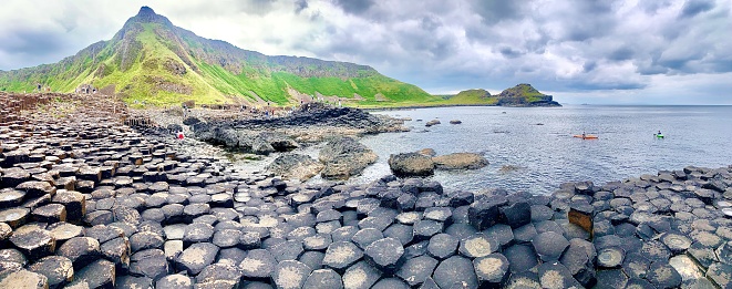 Hexagon rock formations of the Giant Causeway, a UNESCO World Heritage Site, of Northern Ireland, United Kingdom, on a gloomy, cloud day.