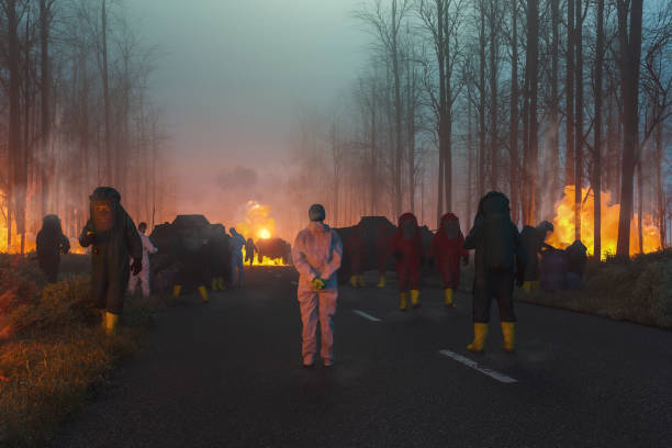 environmental disaster with hazmat team cleaning up - assistência em catástrofes imagens e fotografias de stock