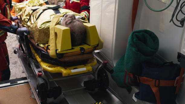 istock Crop paramedics loading injured survivor into vehicle 1356645559