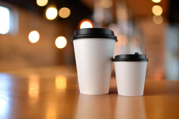 istock White cups with coffee, mock up. 3D rendering and photo. 1356645774