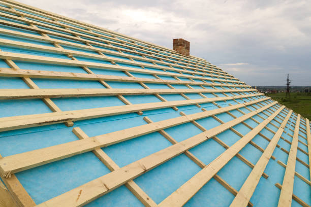 istock Brick house with wooden roof frame under construction. 1356646596