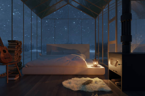 3d rendering of cozy hut with bed and glass panels at snow covered forest stock photo