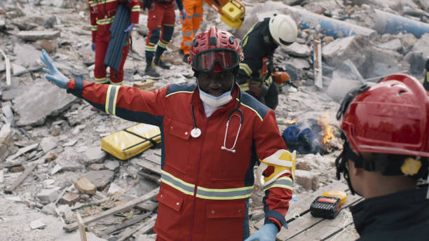 istock Black rescuer speaking with colleague 1356649565
