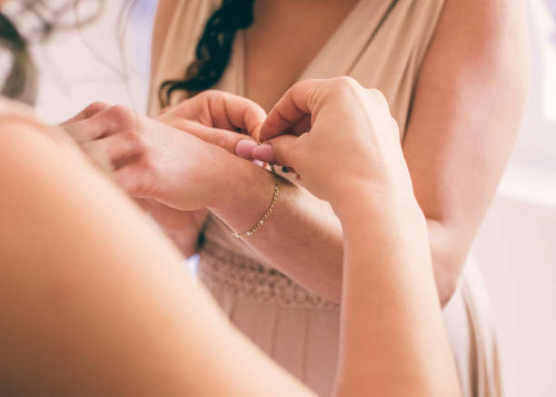 istock Fastening a gold bracelet 1356651031