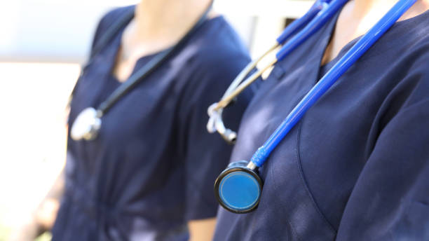 istock Nurses or Doctors in blue hospital uniform with stethoscope 1356654993