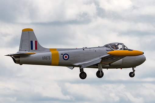 Lincolnshire, UK - July 7, 2014: Former Royal Air Force (RAF) BAC 84 Jet Provost T.4 trainer aircraft (G-BXLO) on approach to land at RAF Waddington.