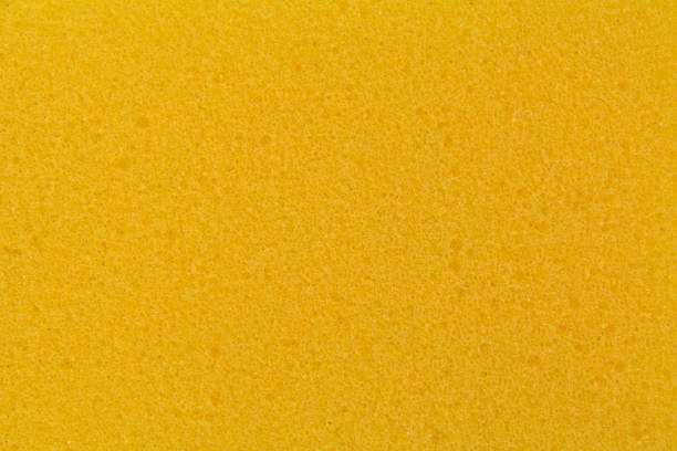 istock texture of yellow dishwashing sponge, close-up 1356660236