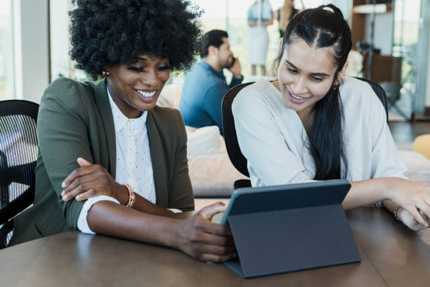 istock Female colleagues participate in virtual meeting 1356661745