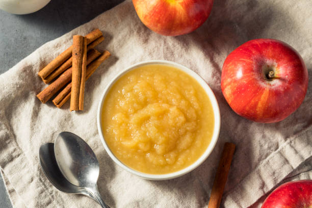 Healthy Organic Raw Apple Sauce Healthy Organic Raw Apple Sauce in a Bowl compote stock pictures, royalty-free photos & images