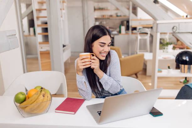 istock Beautiful girl working from her home office 1356668743