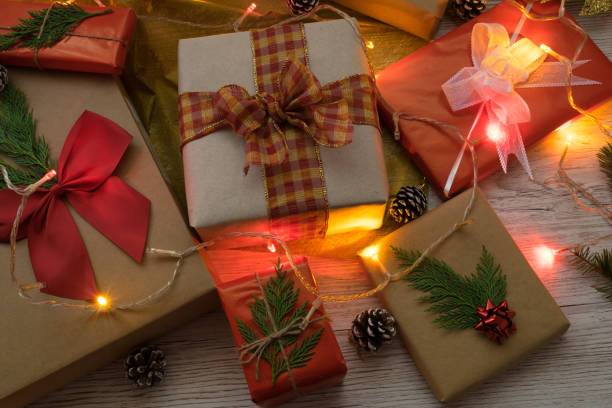 istock Christmas gift boxes wrapped with wrapping paper, bows and lights 1356670559