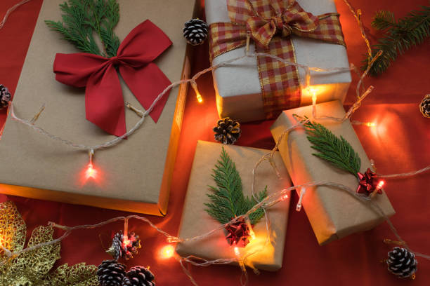 istock Christmas gift boxes on a red background and lights 1356670741