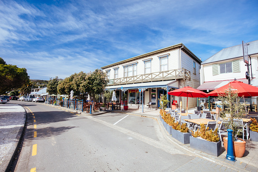 Akaroa, New Zealand - September 18, 2019: Streets and building architecture in the French settlement of Akaroa on Banks Peninsula in New Zealand