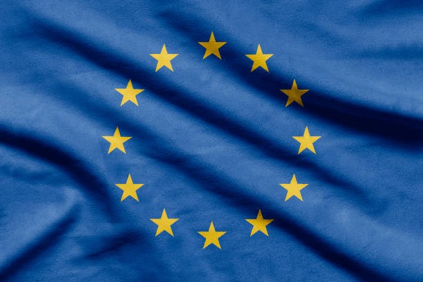 bandierina dell'unione europea su tessuto ondulato. - la comunità europea foto e immagini stock
