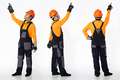 Senior Asian Man wear Orange uniform shirt hardhat and leather glove as engineer construction site