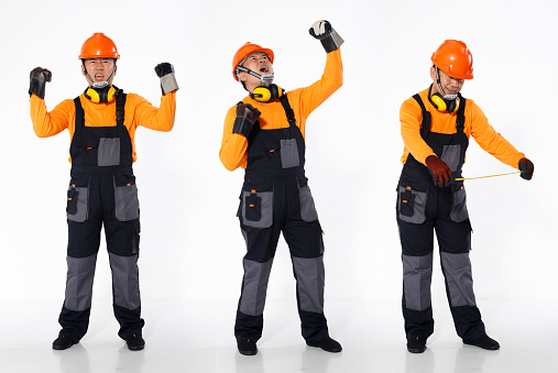 Senior Asian Man wear Orange uniform shirt hardhat and leather glove as engineer construction site