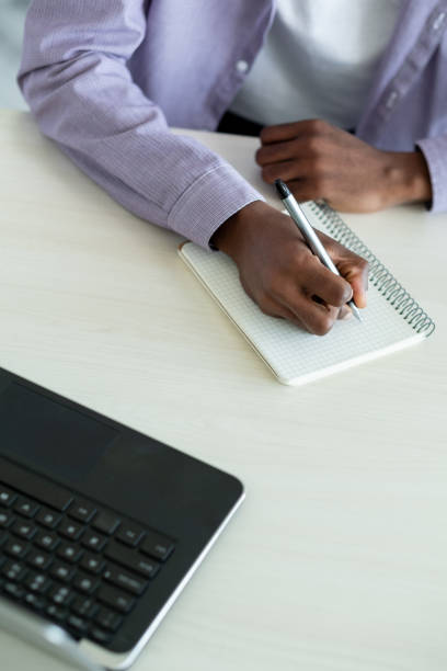 istock home education male student make notes casual 1356677428
