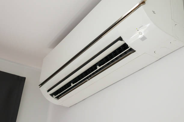 istock Air conditioner on white wall room interior background 1356677490