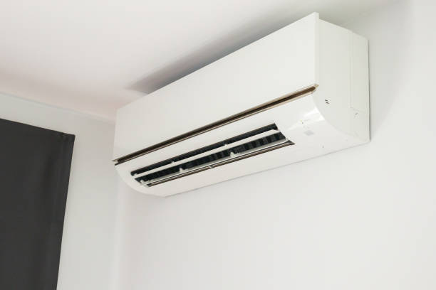 istock Air conditioner on white wall room interior background 1356677506
