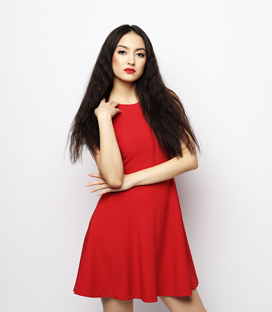 lifestyle and people concept - Young beautiful asian woman wearing red dress, close up