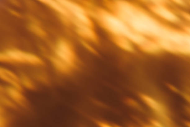 istock blur light overlay bokeh glow golden orange flecks 1356678632