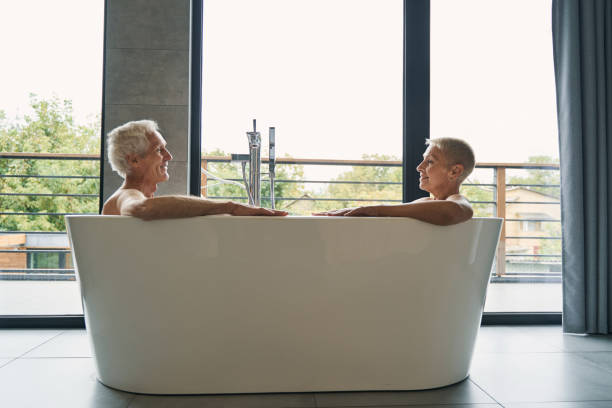 istock Delighted senior man looking at his cute wife 1356679568