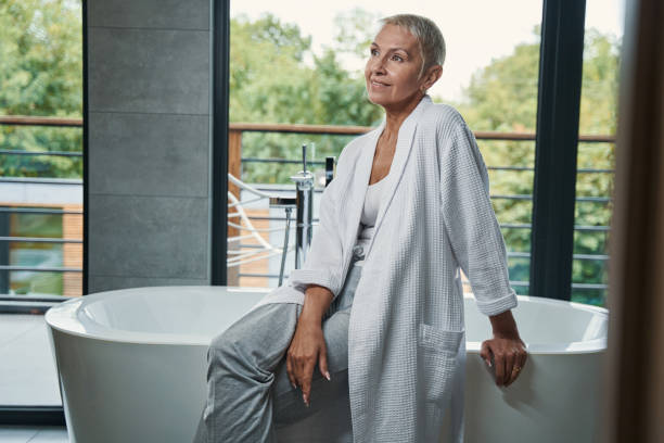 istock Charming senior female spending morning in bathroom 1356679649