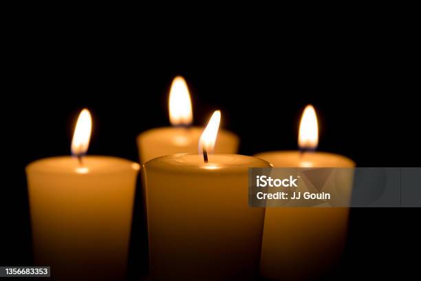 Soft Focus Of White Candles Burning Isolated On Black Background Concept Of Religion Death Memoriam And Peace Stock Photo - Download Image Now