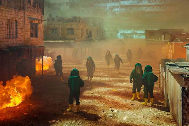 istock Environmental disaster with hazmat team cleaning up 1356696768