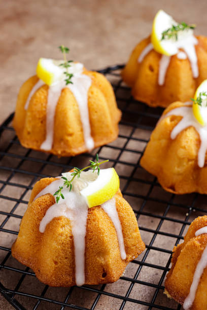 istock Kue lemon. Mini lemon bundt cakes topped with lemon glaze 1356703500