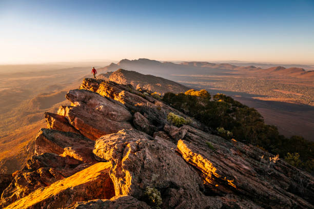 istock A woman hiking on a rocky ridge. 1356703508