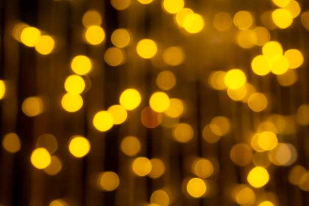 istock Gold bokeh background. blur abstract glowing  bright night effect 1356708225